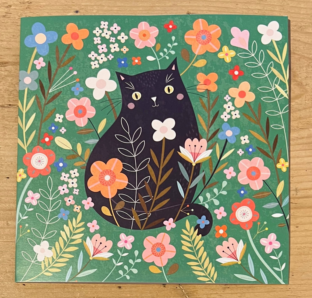 Black Cat Among the Flowers