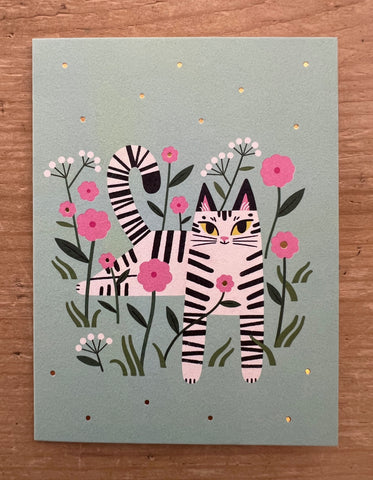 Cat among the flowers green